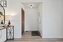Lovely updated steel front door welcomes you home! Bright entry features NEW vinyl flooring, NEW light fixture & opens to spacious living room. - 589 Mohawk Road W, Hamilton, ON 