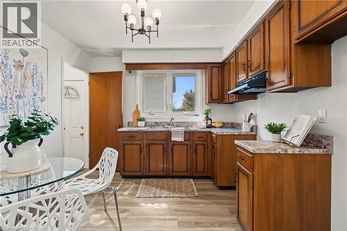 EAT-IN-KITCHEN refreshed!! NEW countertop, NEW LED lights, large vinyl window adds plenty of natural light! Side entry is ideal for BBQ access to patio. - 589 Mohawk Road W, Hamilton, ON 