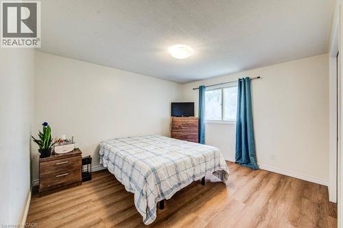 White walls and wood-finish flooring - 143 Sunrise Place, Kitchener, ON 