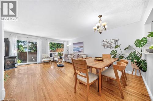 Hardwood-finish flooring throughout, multiple large windows, and a sliding glass door - 1517 Elm Road Unit# 9, Oakville, ON 
