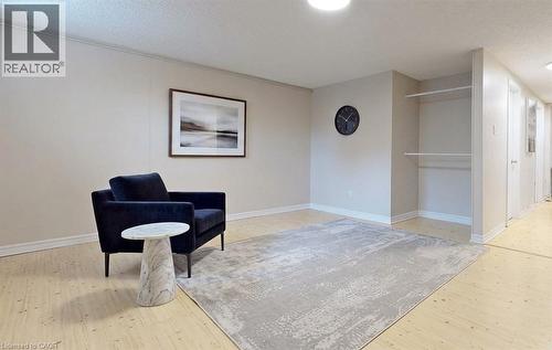 Light wood-finish flooring with neutral wall tones - 1517 Elm Road Unit# 9, Oakville, ON 