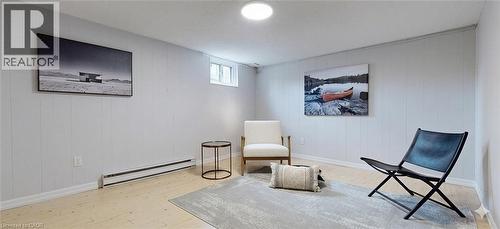 Recessed ceiling lighting, light wood-finish flooring, white paneled walls, and a window with white trim - 1517 Elm Road Unit# 9, Oakville, ON 