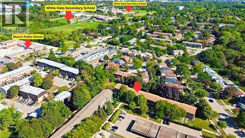Aerial perspective of a residential area with multiple detached and attached properties, established tree cover, and paved roadways - 1517 Elm Road Unit# 9, Oakville, ON 