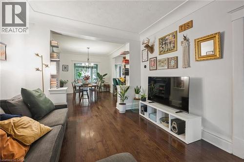 Hardwood flooring, recessed archway, and cove ceiling - 58 Balmoral Avenue N, Hamilton, ON 