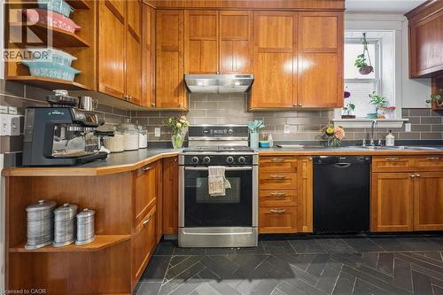 Custom cabinetry with integrated open shelving - 58 Balmoral Avenue N, Hamilton, ON 