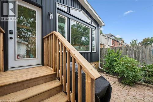 Wood decking, and a full-light entry door - 58 Balmoral Avenue N, Hamilton, ON 