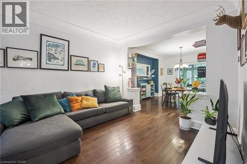 Hardwood flooring, recessed archway, and cove ceiling - 58 Balmoral Avenue N, Hamilton, ON 