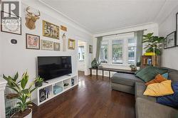 Hardwood flooring, window bench, cove ceiling - 