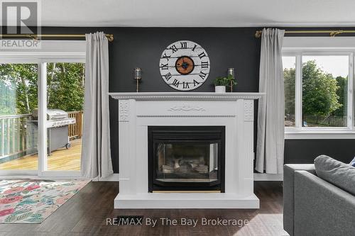 Gas Fireplace in  a Custom Built Surround - 2 Red Oak Drive, Wasaga Beach, ON 
