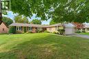 Brick exterior with a gabled roof and attached garage - 15 Mclaren Avenue N, Listowel, ON 