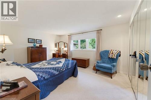 Recessed ceiling lighting, window with curtain rod, and mirrored closet doors with polished hardware - 15 Mclaren Avenue N, Listowel, ON 