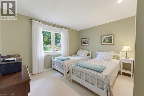 Carpeted flooring paired with a large window - 15 Mclaren Avenue N, Listowel, ON 