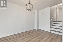 Lovely dining area; NEW light fixture & viny flrg - 
