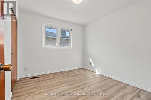 BEDROOM 2; closet, window & NEW vinyl flooring. - 589 Mohawk Road W, Hamilton (Gilbert), ON 