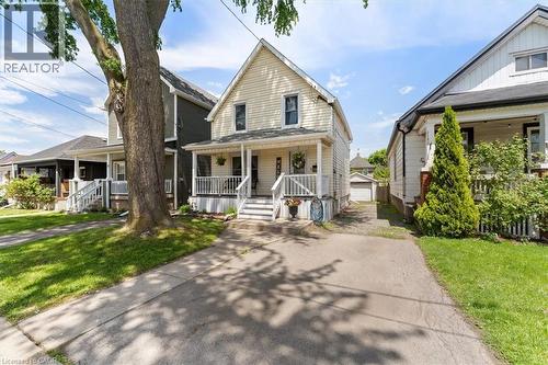 Traditional two-story home with light-colored siding - 17 Craigmiller Avenue, Hamilton, ON 