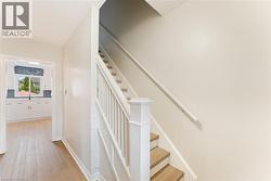 Staircase with wood-finish treads and white risers - 