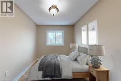 Recessed window with white trim, wood-finish flooring, and a ceiling-mounted light fixture - 