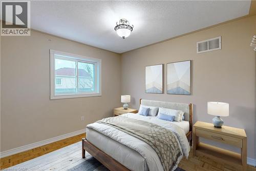 Recessed window with white trim, wood-finish flooring, and a ceiling-mounted light fixture - 21 Eastview Gate Unit# 36, Brampton, ON 