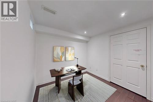 Recessed ceiling lighting, a narrow high-set window, and wood-finish flooring - 21 Eastview Gate Unit# 36, Brampton, ON 