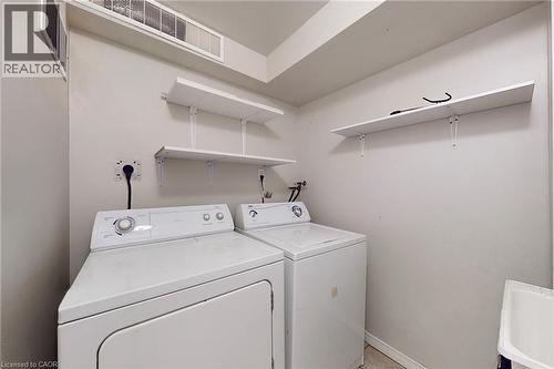 Dedicated laundry area with wall-mounted shelving and utility sink - 21 Eastview Gate Unit# 36, Brampton, ON 