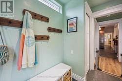 Transom window, wall hooks, closet, slate tile - 