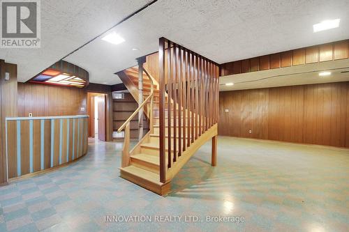 Lower level curved staircase - 1136 Castle Hill Crescent, Ottawa, ON 