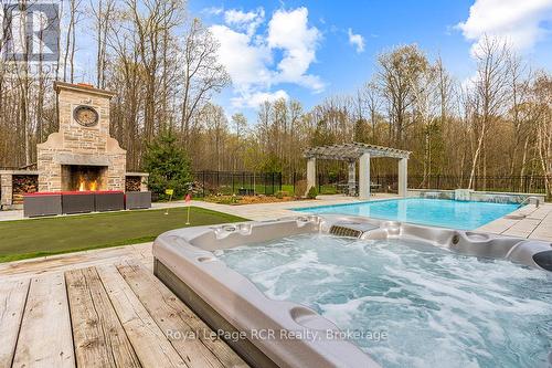 Stunning ftone fireplace, pool & hot tub. - 758335 Girl Guide Road, Georgian Bluffs, ON 