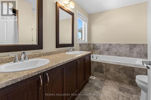 Primary ensuite with double vanity and soaker tub - 223 Serra Ridge, Ottawa, ON 