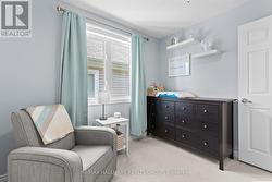 Second bedroom with window and dresser - 