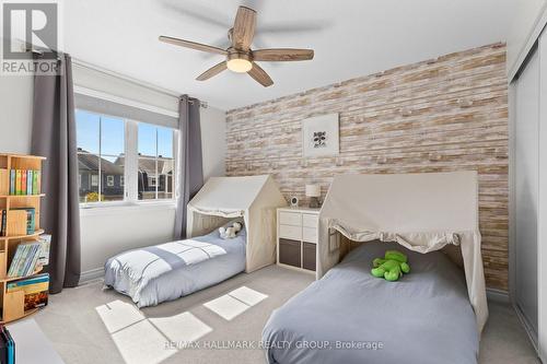 Third bedroom with feature wall and play space - 223 Serra Ridge, Ottawa, ON 