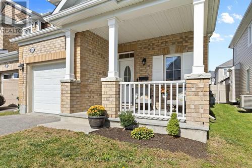Enclosed front porch and brick exterior - 223 Serra Ridge, Ottawa, ON 