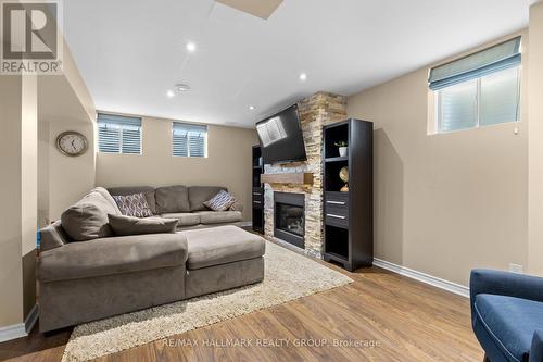 Basement family room with gas fireplace - 223 Serra Ridge, Ottawa, ON 