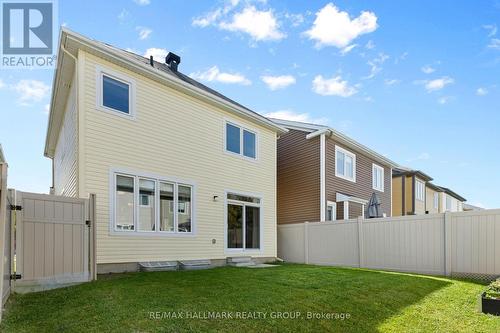 Rear exterior and fully fenced backyard - 223 Serra Ridge, Ottawa, ON 