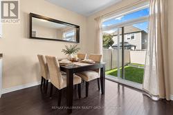 Dining area with sliding doors to backyard - 