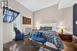 Hardwood flooring and striped wallpaper accent - 