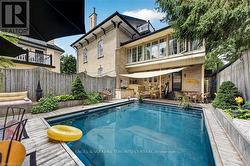 Swimming pool with composite decking surround - 