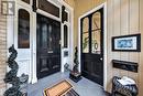 Exterior entryway with a paneled door - 100 Brunswick Street, Stratford, ON 