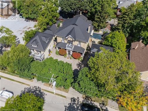 Stone facade residence with a dark-pitched roof - 100 Brunswick Street, Stratford, ON 