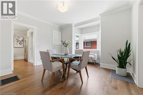 Hardwood flooring, crown molding, bay window, recessed ceiling light, and crisp white trim - 87 Strathcona Avenue, Brantford, ON 