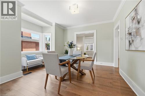 Hardwood flooring, crown molding, bay window, recessed archways, and a contemporary ceiling fixture - 87 Strathcona Avenue, Brantford, ON 