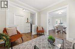 Hardwood flooring throughout, recessed lighting, and crown molding - 