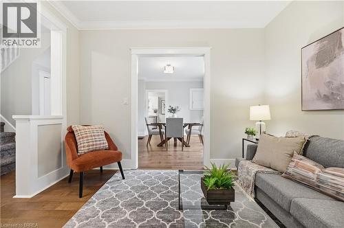 Hardwood flooring with crown molding and white trim details - 87 Strathcona Avenue, Brantford, ON 
