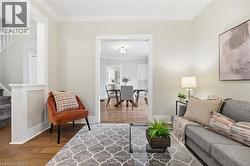 Hardwood flooring with crown molding and white trim details - 