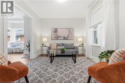 Bright living space with light-toned walls, recessed lighting, and wood-finish flooring - 87 Strathcona Avenue, Brantford, ON 