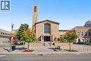 Stone facade with a tall bell tower and large arched windows - 97 Wellington Street, Brantford, ON 