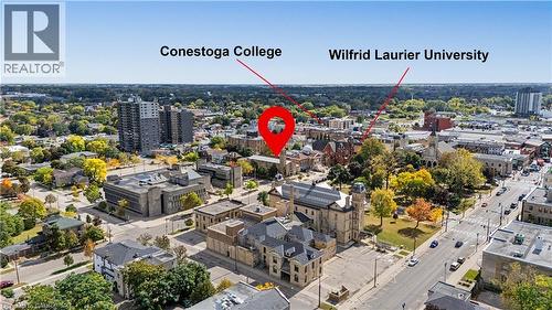 Aerial perspective of the surrounding area, showcasing urban architecture, visible roadways, and mature trees - 97 Wellington Street, Brantford, ON 