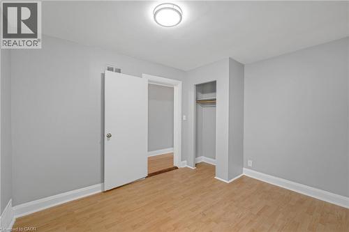 Wood-finish flooring, light gray wall tones, and white trim - 211 Wentworth Street N, Hamilton, ON 