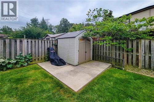 Expansive green lawn with a privacy fence - 214 Cloverleaf Drive, Ancaster, ON 