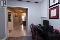 Wood-finish flooring with a tiled hallway - 