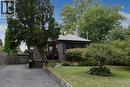 Brick exterior with a gabled roof and prominent chimney - 154 Ewen Road, Hamilton, ON 